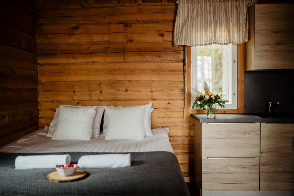 Cozy bed in Bearhill husky wilderness cabin, Rovaniemi, Lapland, Finland