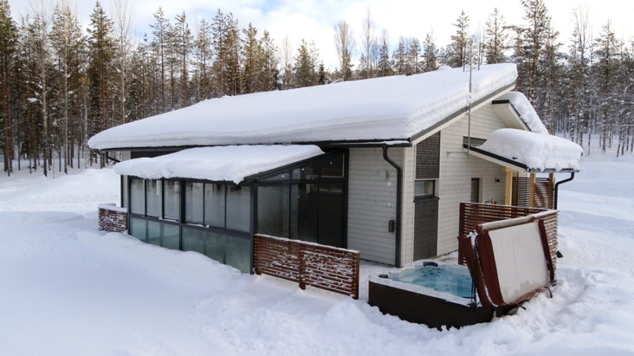 Cottage from the back with hot tub