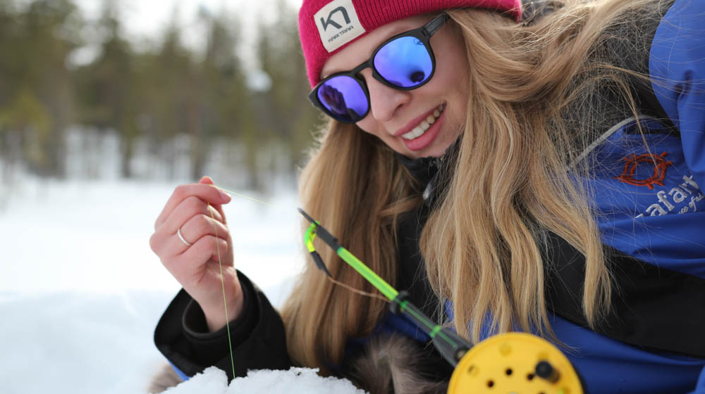 Ice fishing with Safartica in Rovaniemi, Lapland, Finland