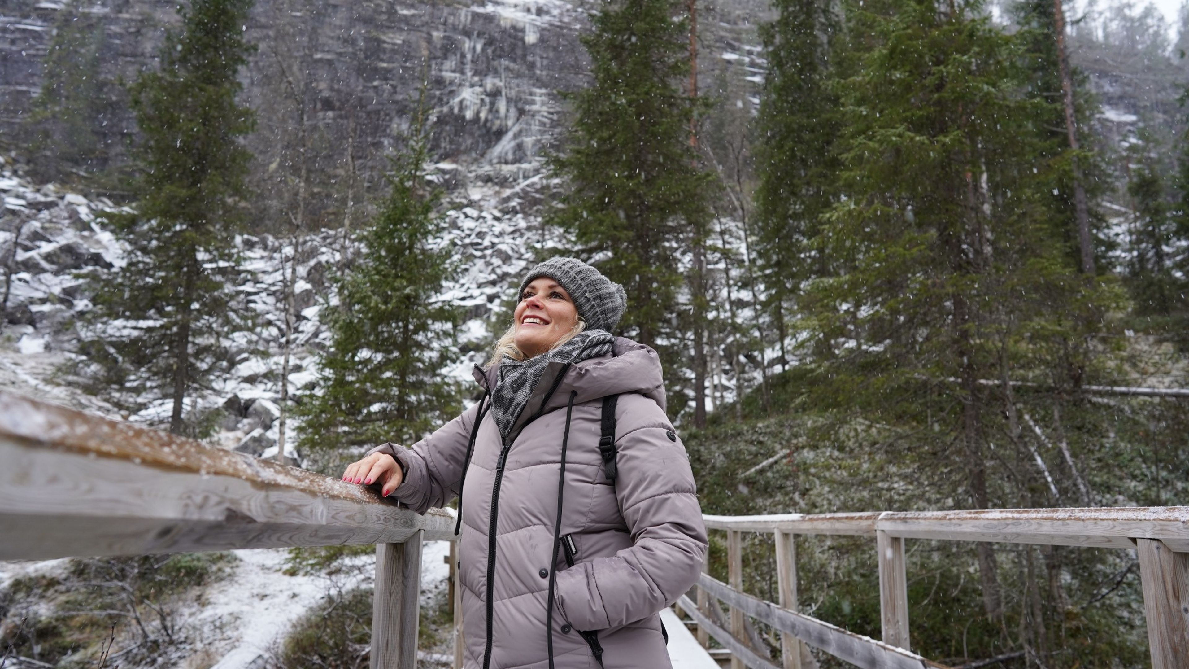 Woman enjoying snowy forest scenery with Lapland Fox Tours, Rovaniemi, Lapland, Finland