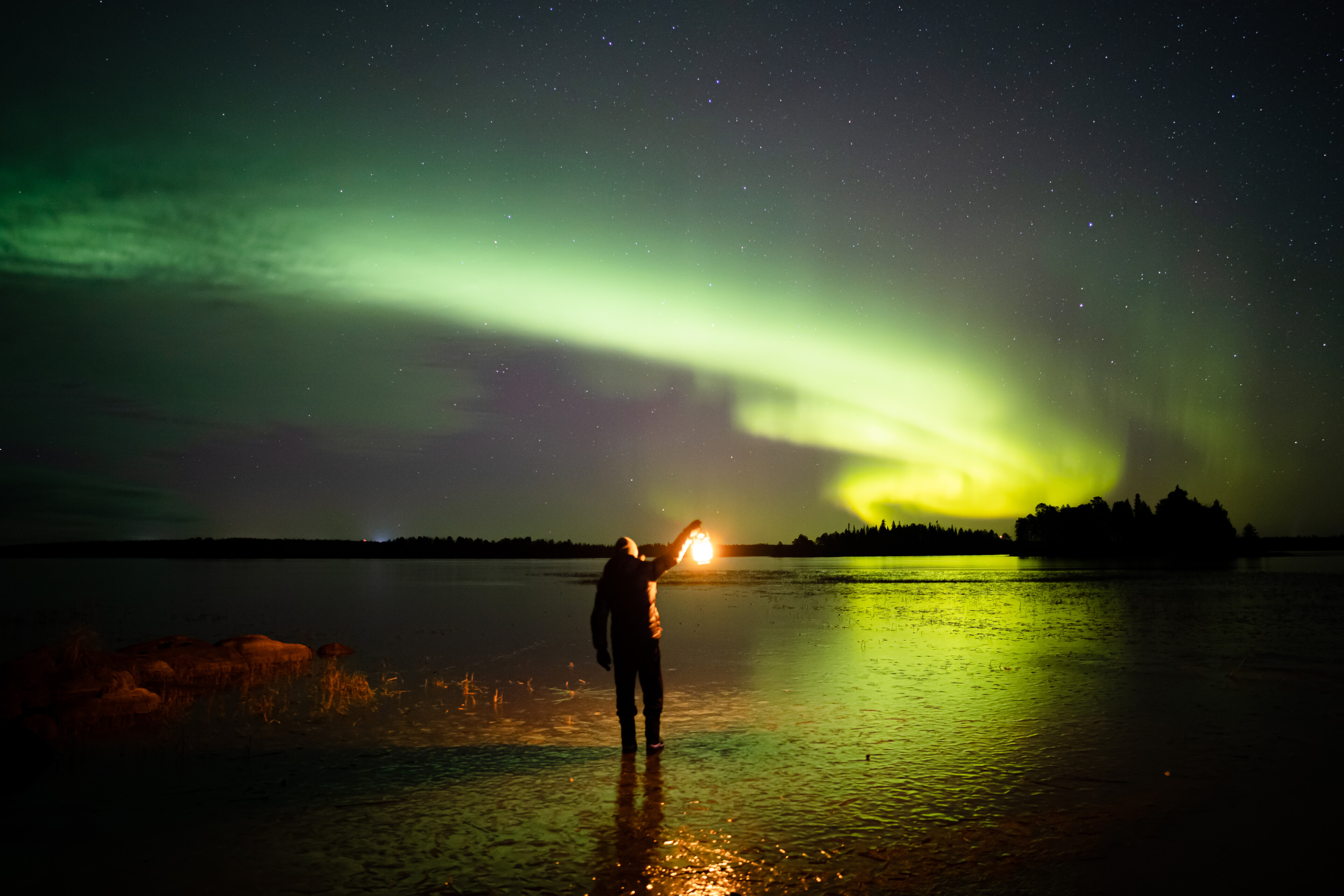 Northern Lights dancing in the sky in Rovaniemi, Lapland, Finland.