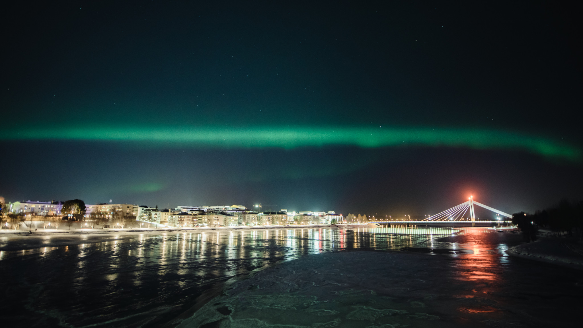 Northern Lights dancing over Rovaniemi city centre in Lapland, Finland.