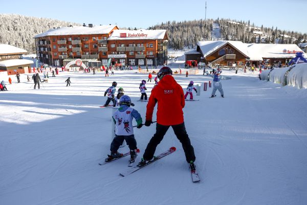 Ruka Ski Resort people downhill skiing with a guide