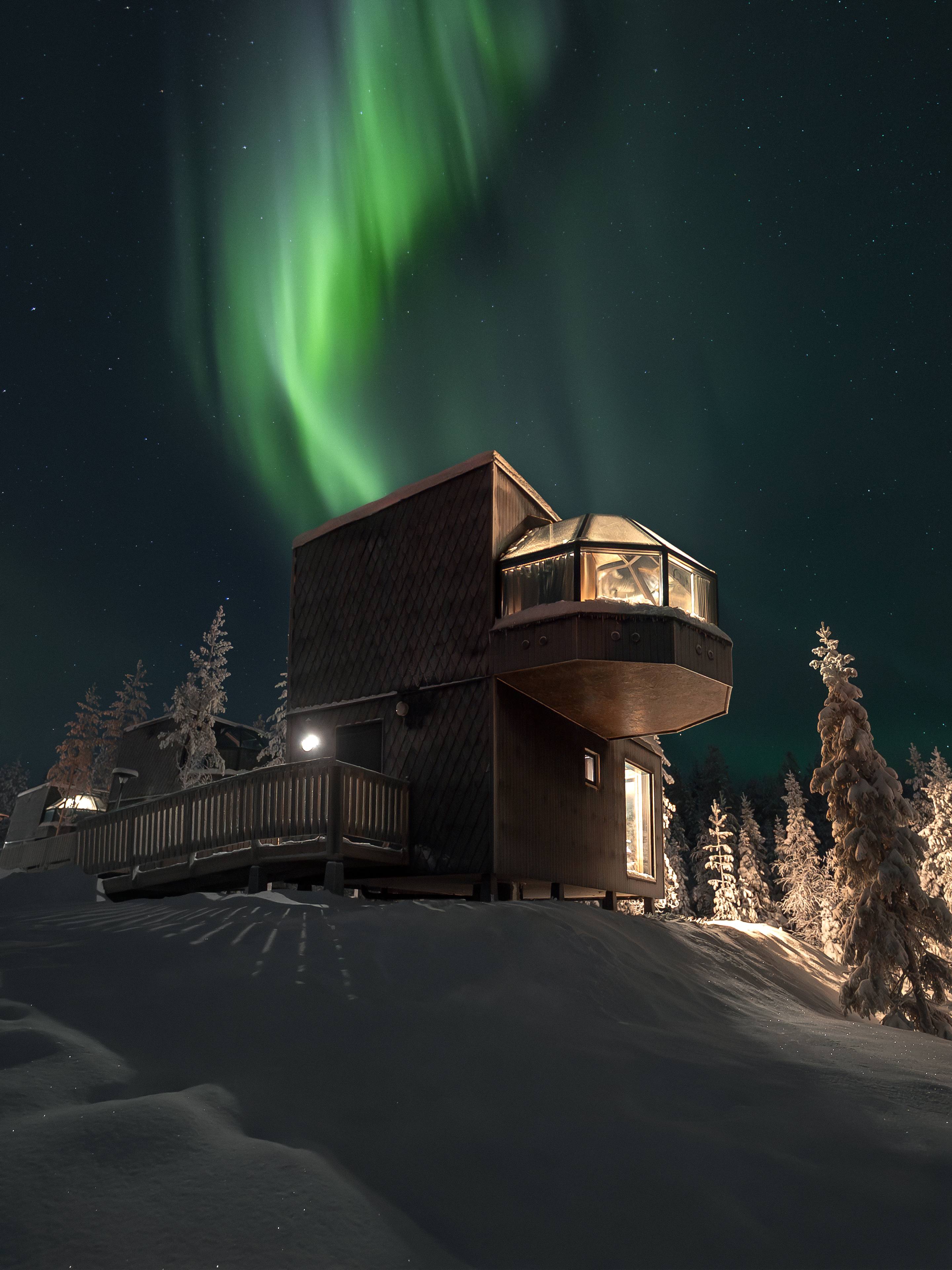 Igloo under northern lights in winter at SkyView Igloo Resort and Spa in Rovaniemi, Lapland, Finland