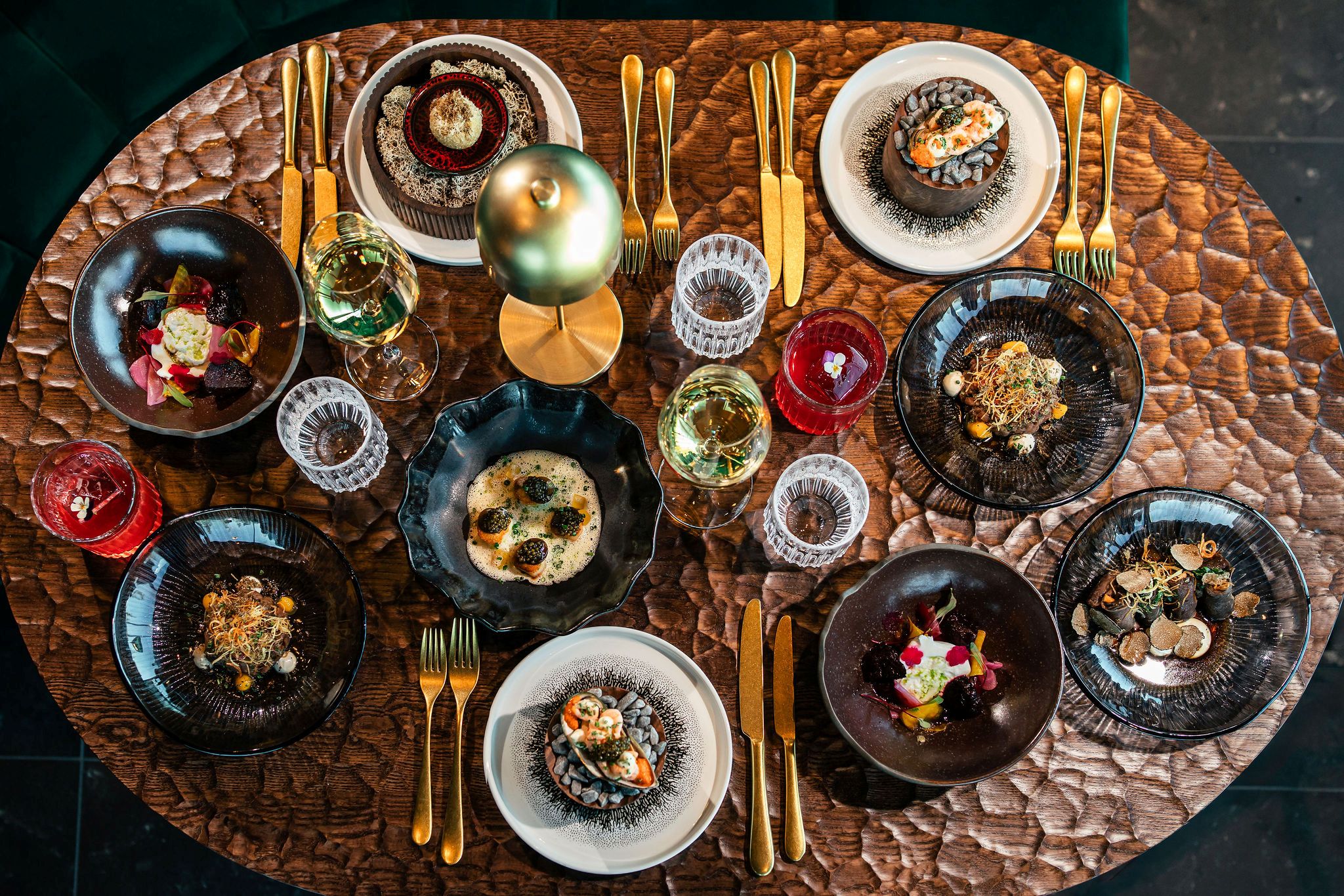 Elegant dining table with gourmet dishes at Restaurant Aura at Skyview Igloo Resort and Spa