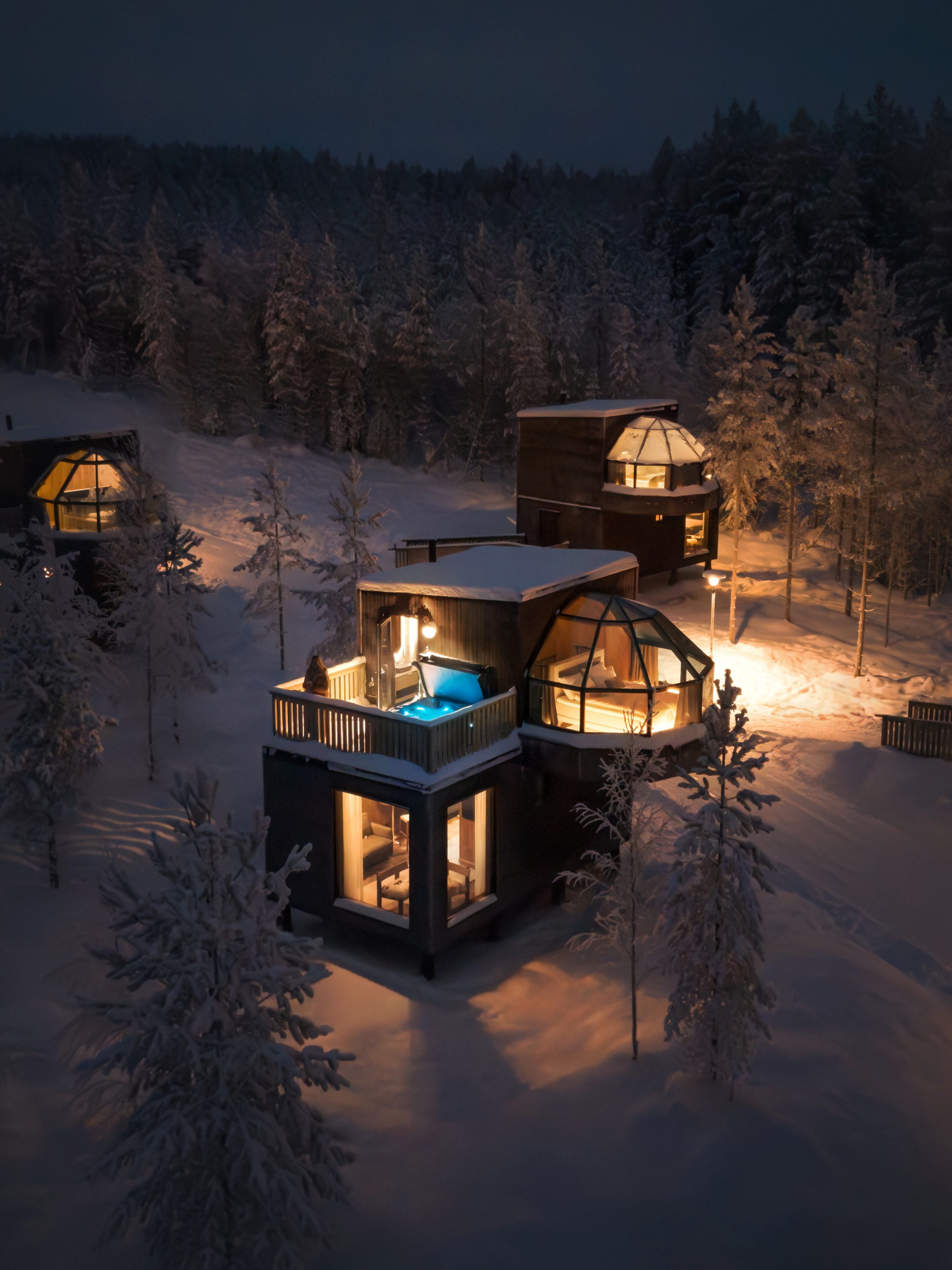 Igloos in snowy forest setting at SkyView Igloo Resort and Spa in Rovaniemi, Lapland, Finland