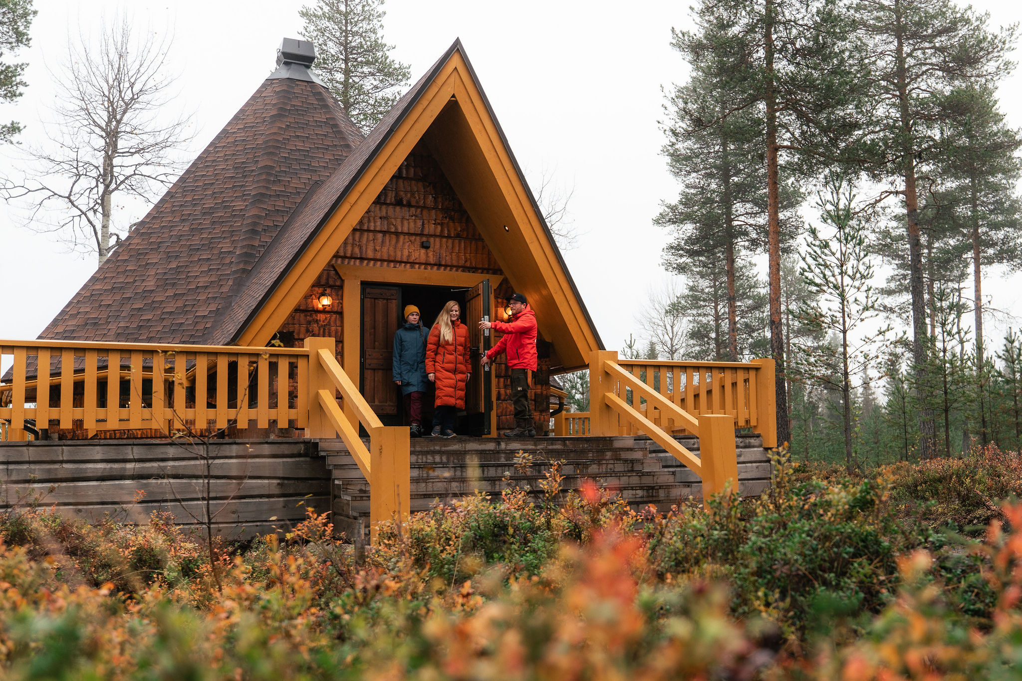 Cozy cabin surrounded by autumn foliage at Taava Reindeer Farm, Rovaniemi, Lapland, Finland