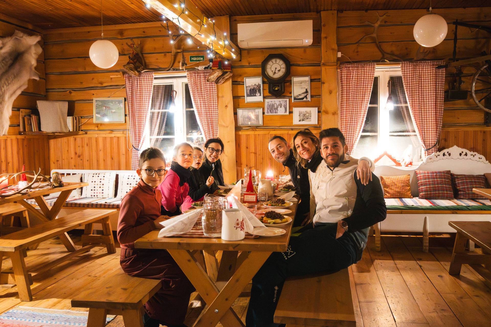 Family gathered around a table ready to eat.