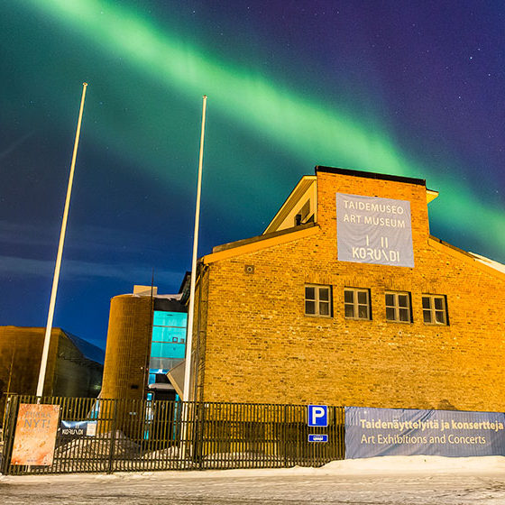 The Northern Lights over Korundi House of Culture in Rovaniemi, Lapland, Finland