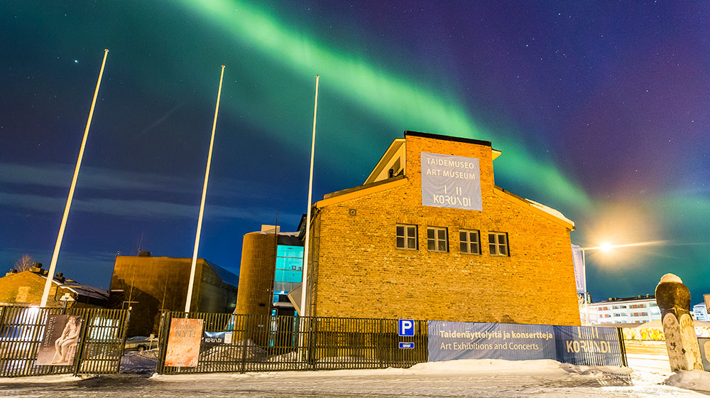 The Northern Lights over Korundi House of Culture in Rovaniemi, Lapland, Finland